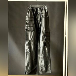 Black leather cargo pants. Never worn and have a some stretch. Also soft inside